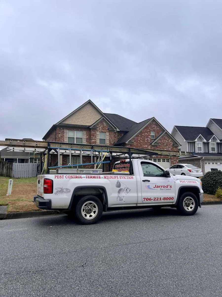 Jarrod's Pest Control truck parked outside a Columbus home