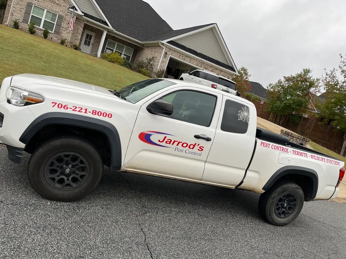 Jarrod's Pest Control truck parked at a Columbus home
